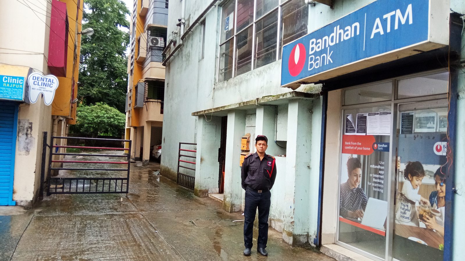 A JFM guard on duty outside a bank ATM branch