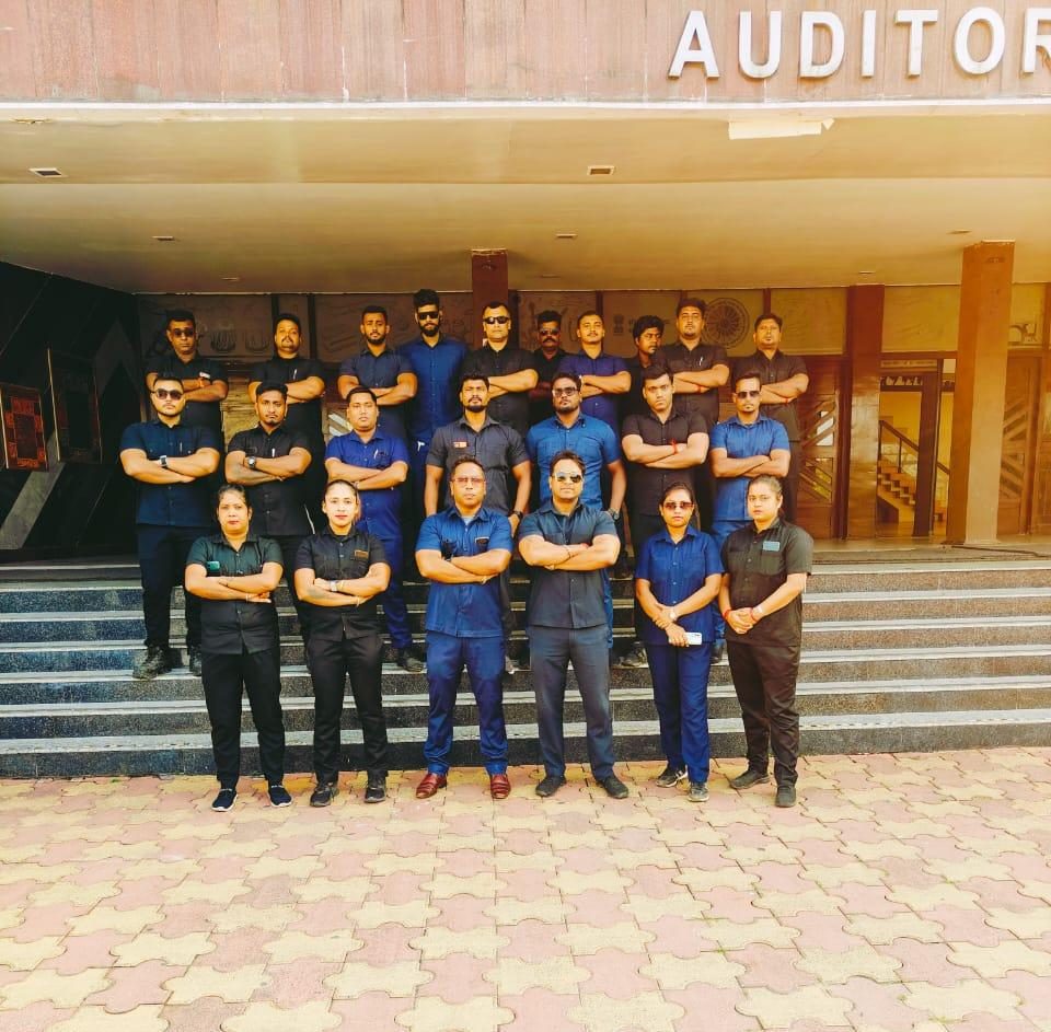 JFM bouncer team assembled in an auditorium before an event