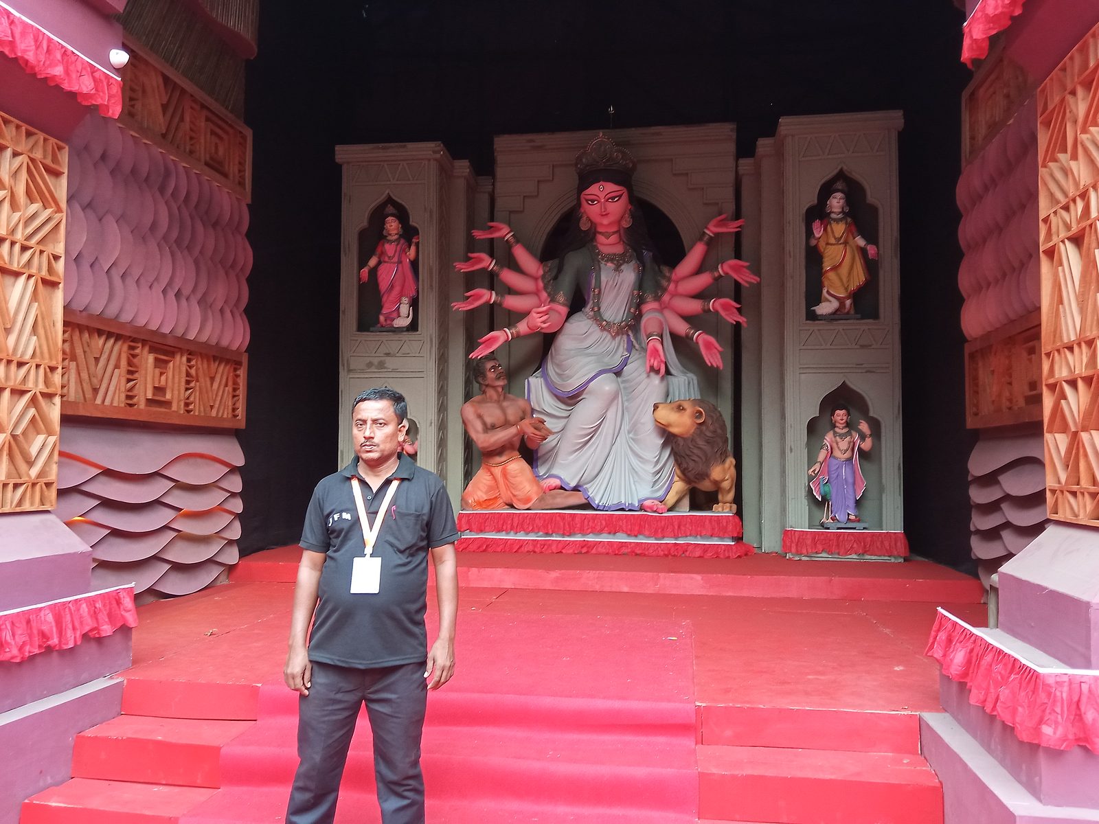 A JFM guard on duty at a Durga Puja pandal