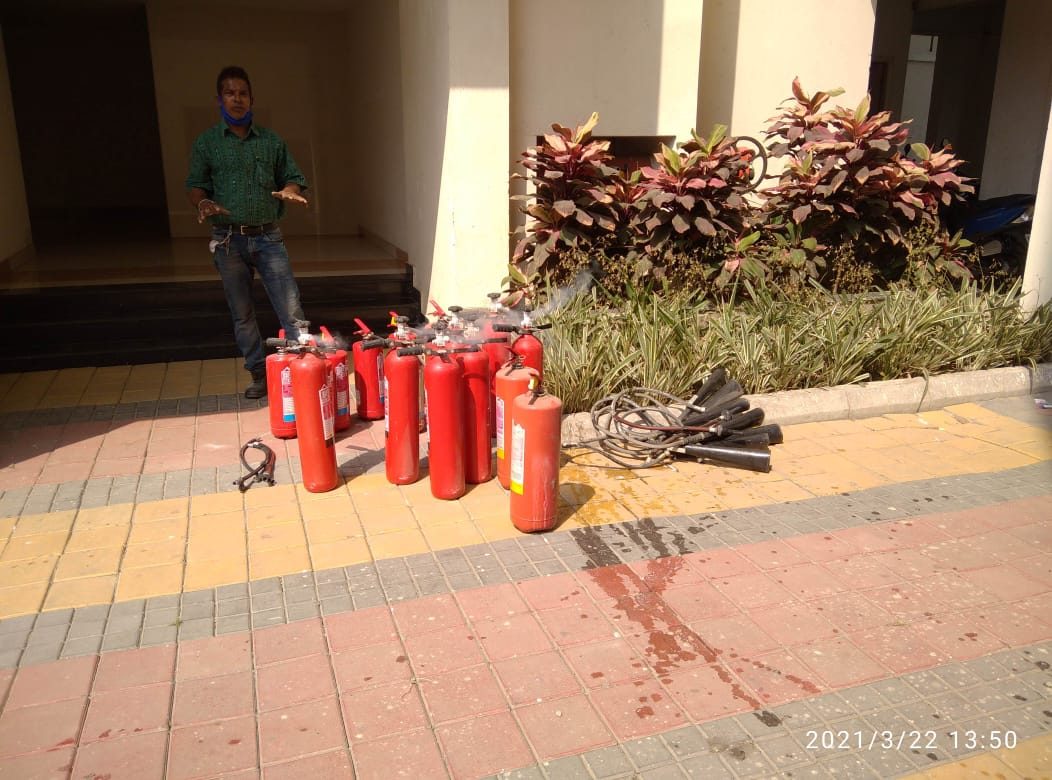 Fire extinguishers laid out for a training exercise