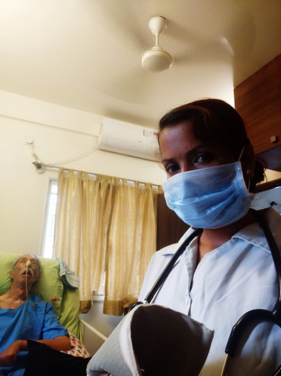 A JFM nursing attendant caring for a patient at home
