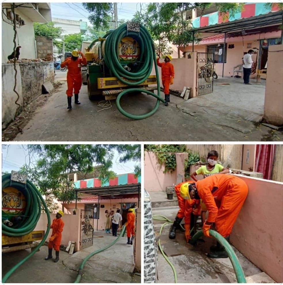 Septic tank emptying with a vacuum tanker in a residential lane